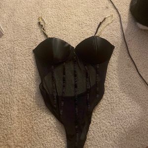 Black mesh bodysuit with gold chain straps